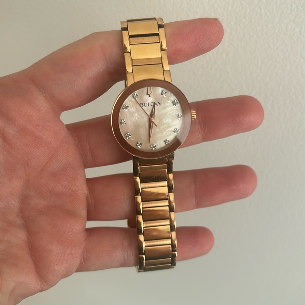 Bulova watch. Morher of pearl face with diamonds. Excellent condition.